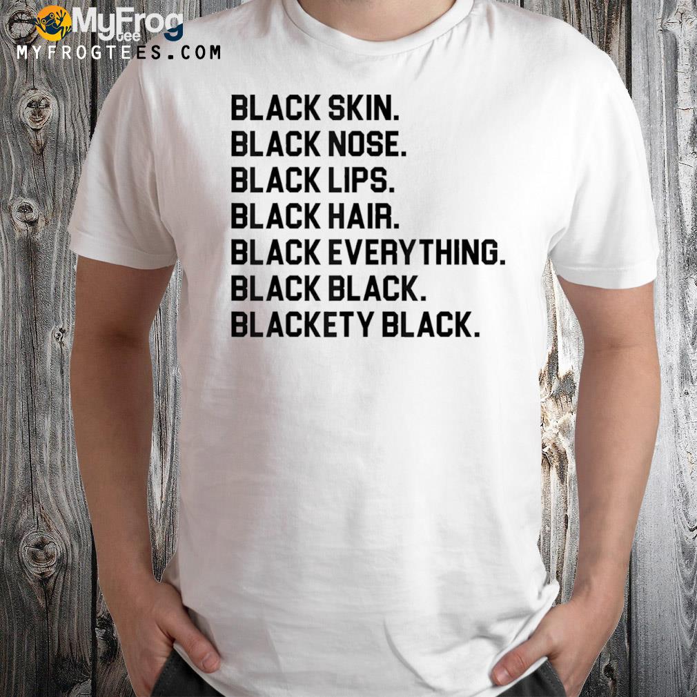 Black skin nose lips hair everything blackety black shirt